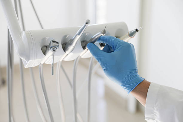 Professional Tooth Extraction technician working in Hall County County, GA